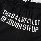 THAT'S A AWFUL LOT OF COUGH SYRUP Black Graphic Shorts ¡ª detail